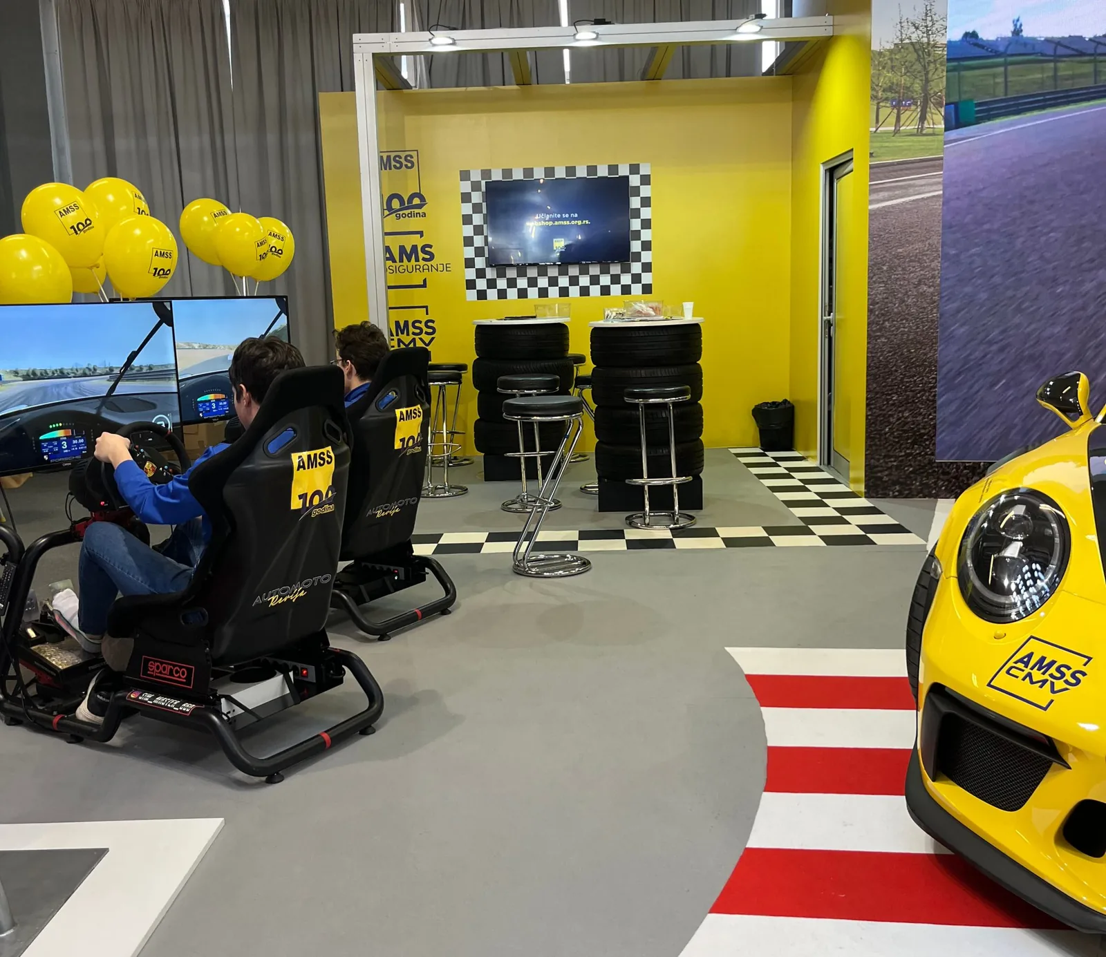 Sim Master simulators on the AMSS stand at a car show