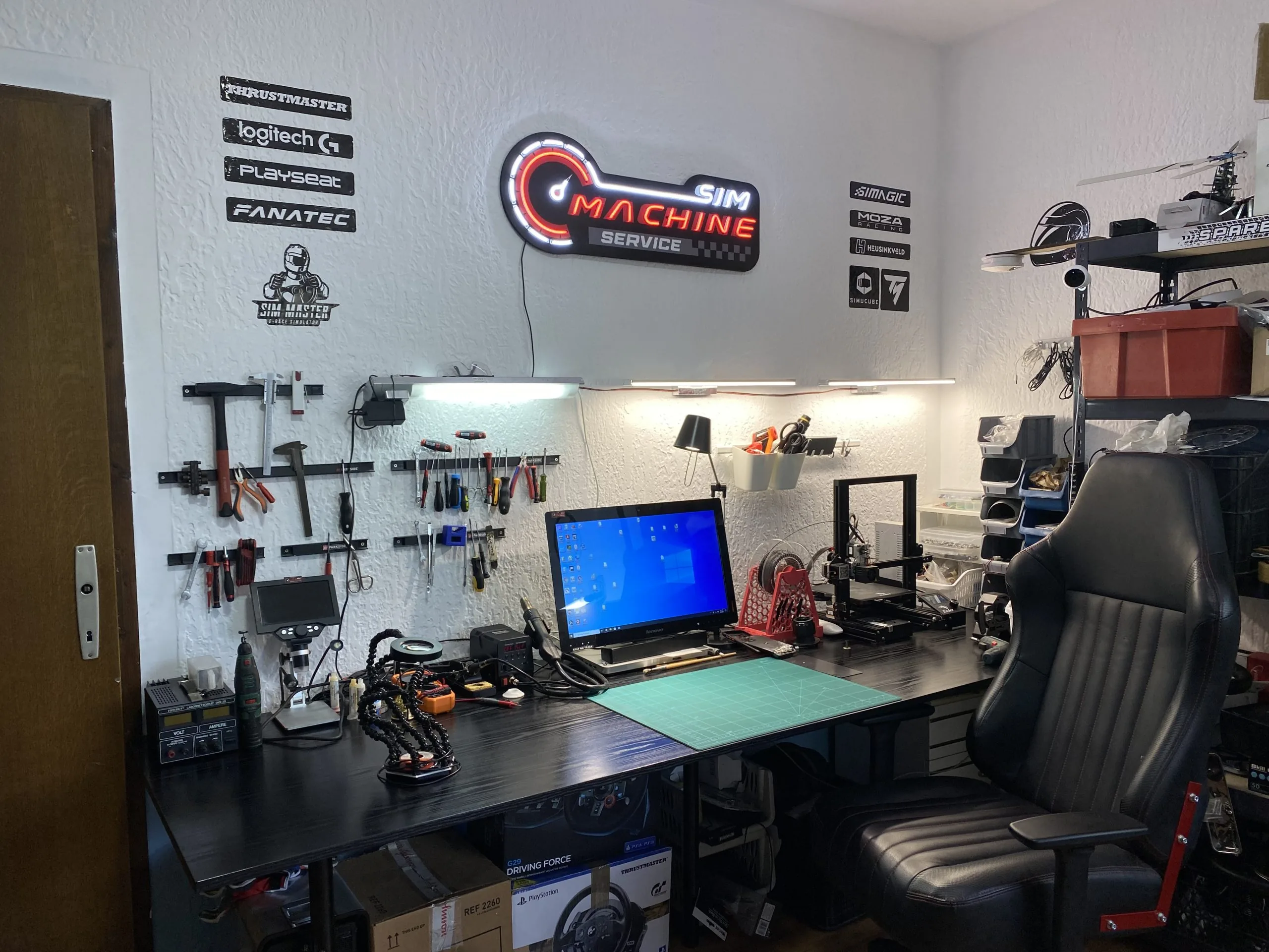 The Sim Machine service workshop with sim racing equipment for racing simulators
