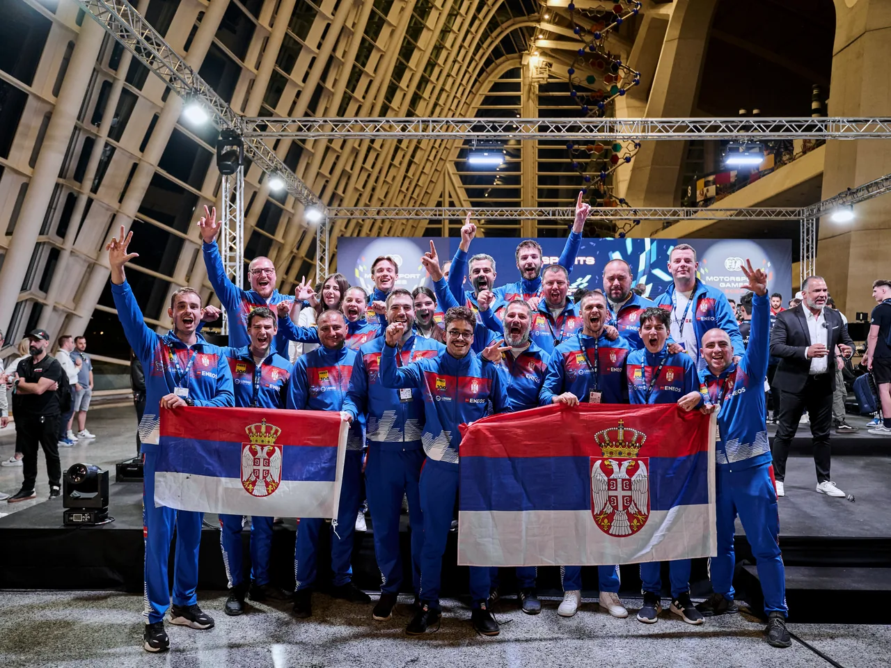 Team Serbia celebrating with flags at the FIA Motorsport Games