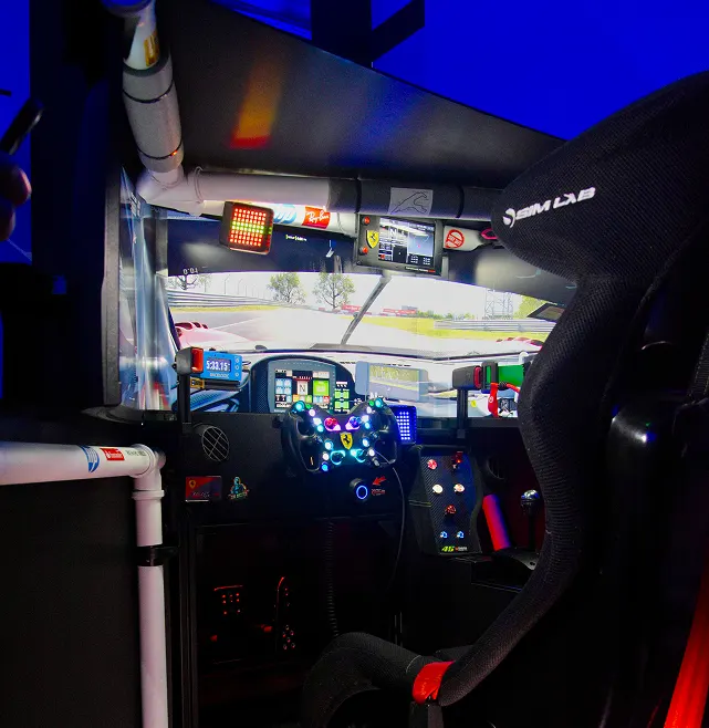 PC Rig with an enclosed cockpit and three screens