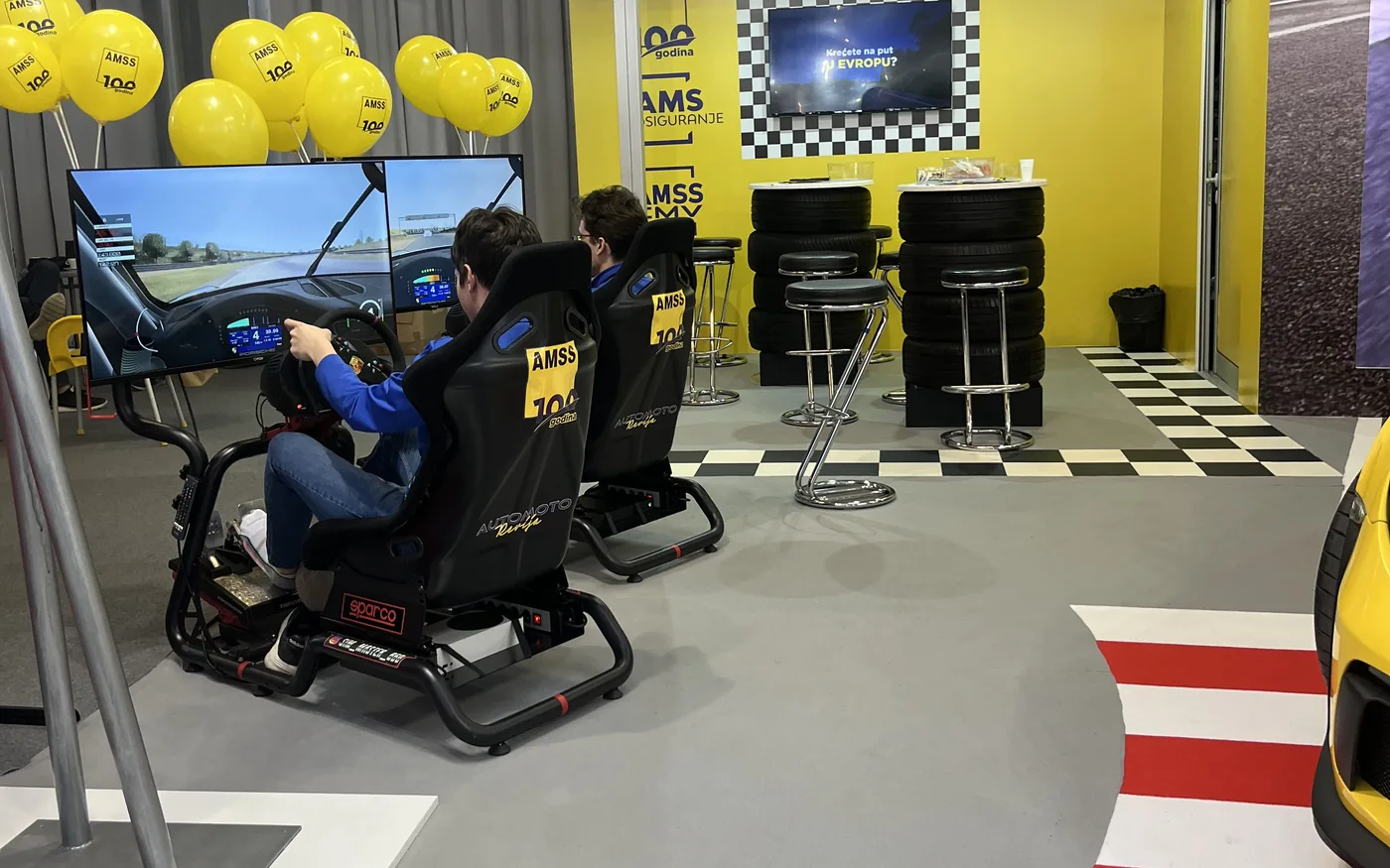 Sim Master racing simulators at the AMSS stand — simulators for corporate events